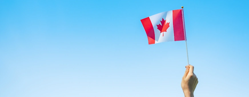 life-assure-hand-holding-a-canadian-flag