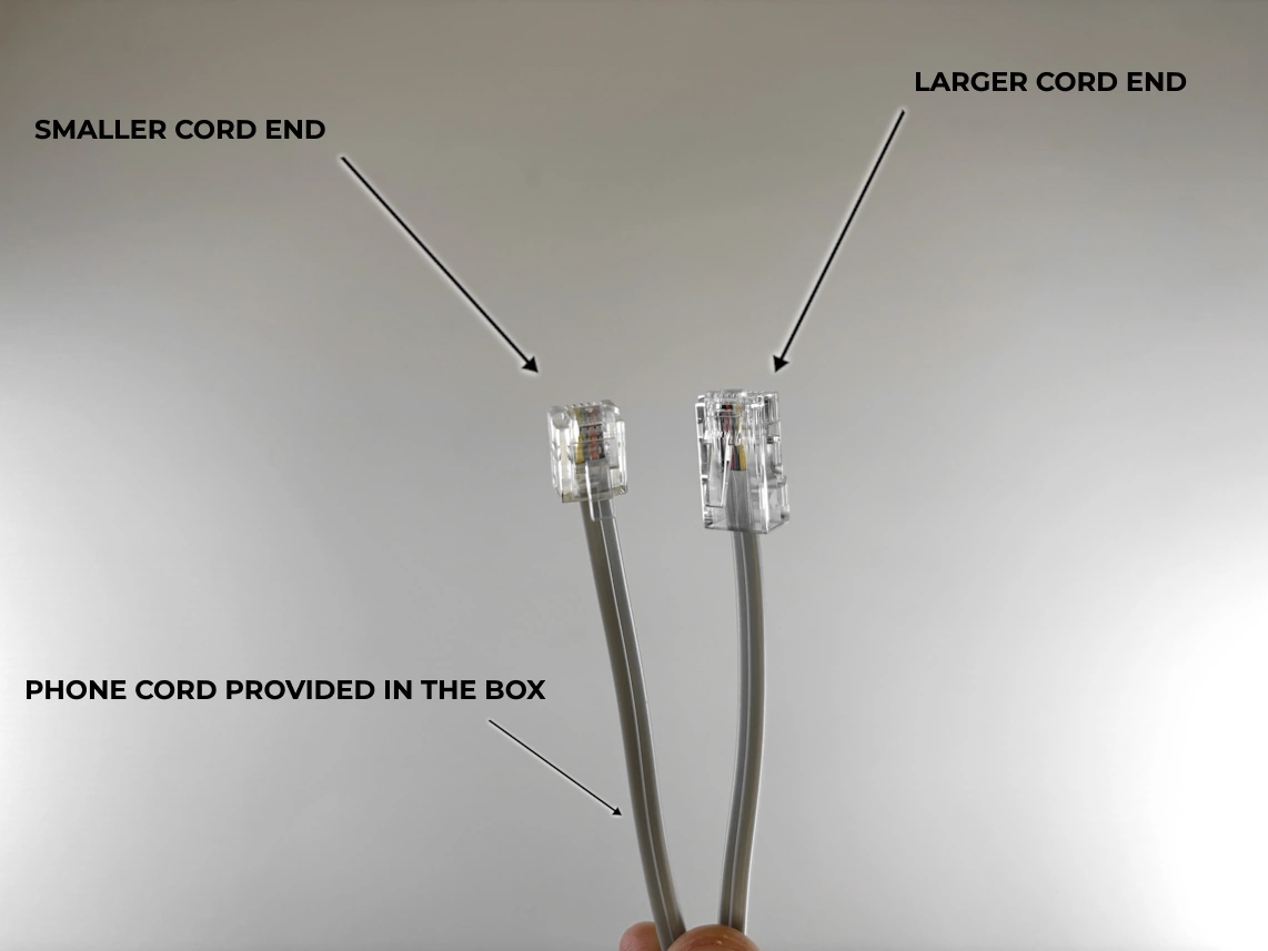 provided in the box phone cord with the arrows pointed at smaller cord end and larger cord end.