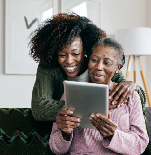 life-assure-medical-alert-senior-happily-smiles-with-loved-one