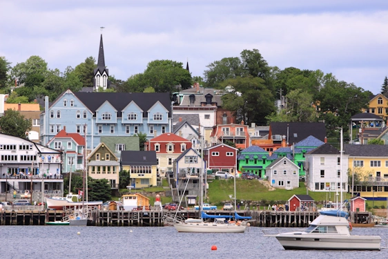 Nova Scotia Lunenburg waterfront piers image with boats floating on the water