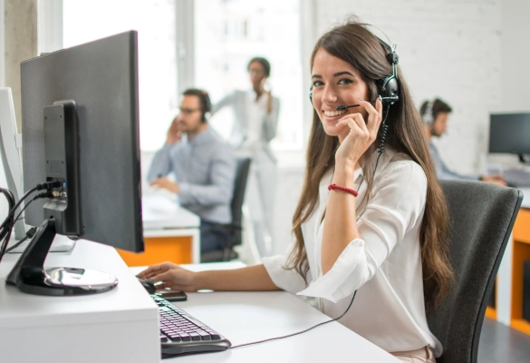 Monitoring Specialist Smiling and Speaking with Headset